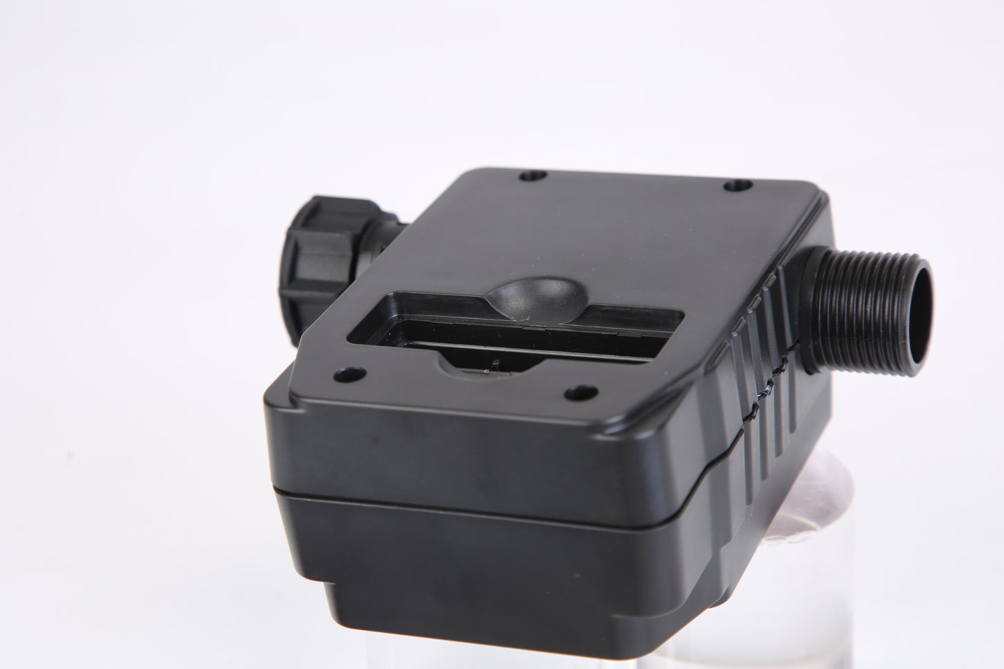 Black mechanical component on a white background