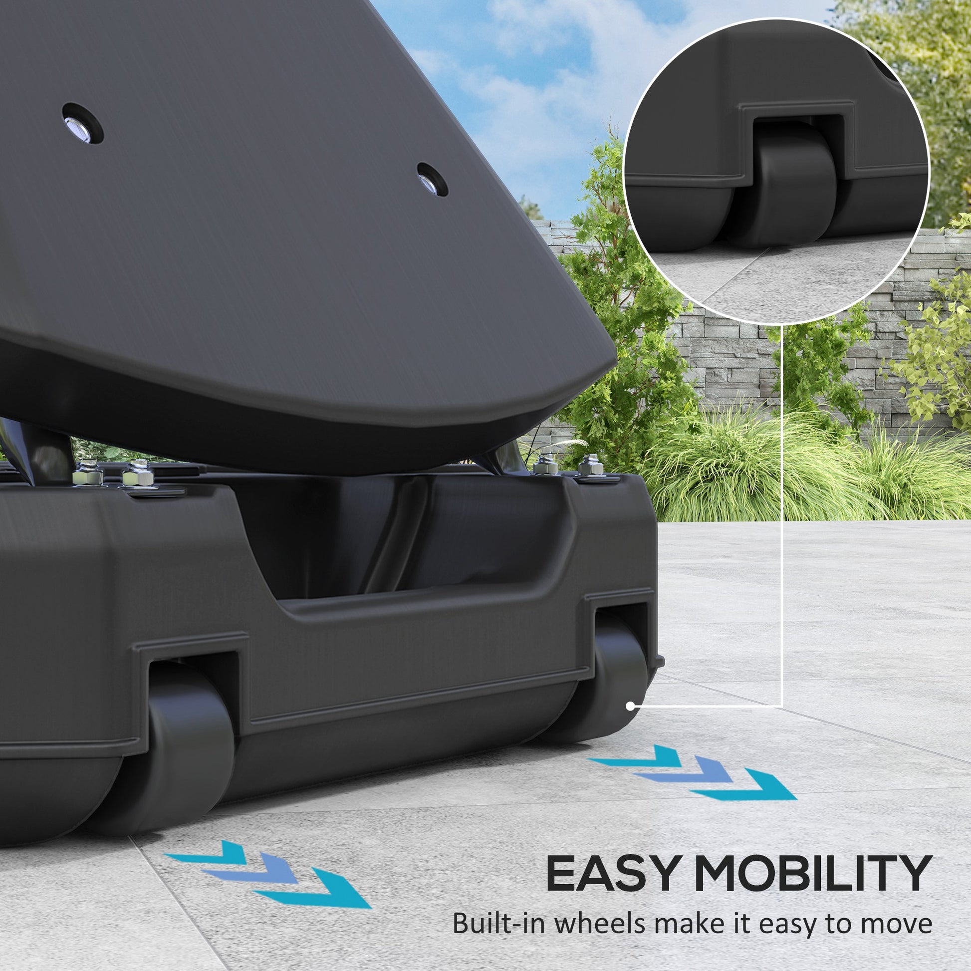 Black scooter with wheels on a concrete surface, surrounded by greenery.