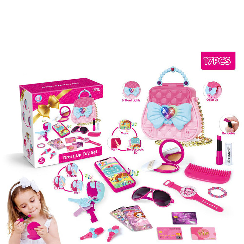 Dress-up toy set with pink purse, mirror, and accessories displayed in front of its packaging.