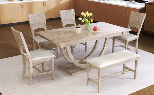 Dining table set with chairs and a bench in a kitchen