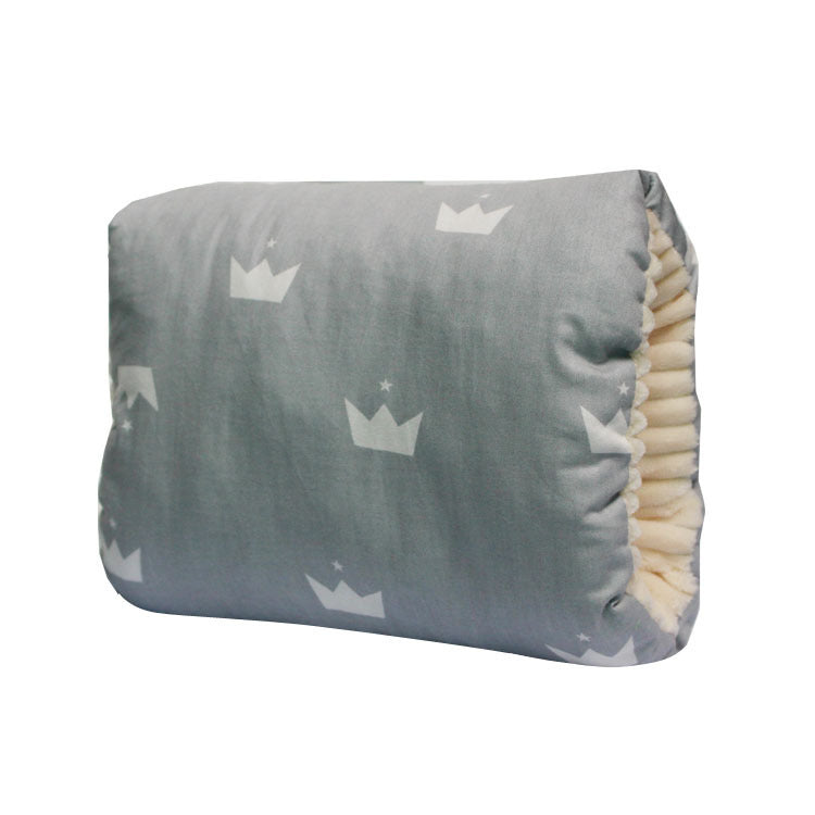 A collection of nursing pillows in various patterns and colors, with a mother breastfeeding a baby on one of the pillows.