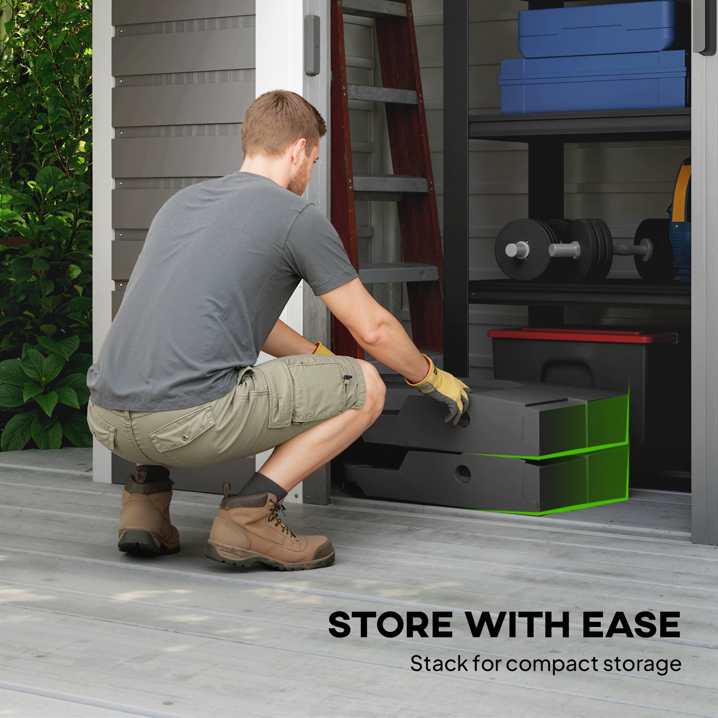 Person organizing storage space with a compact storage unit in a garage.