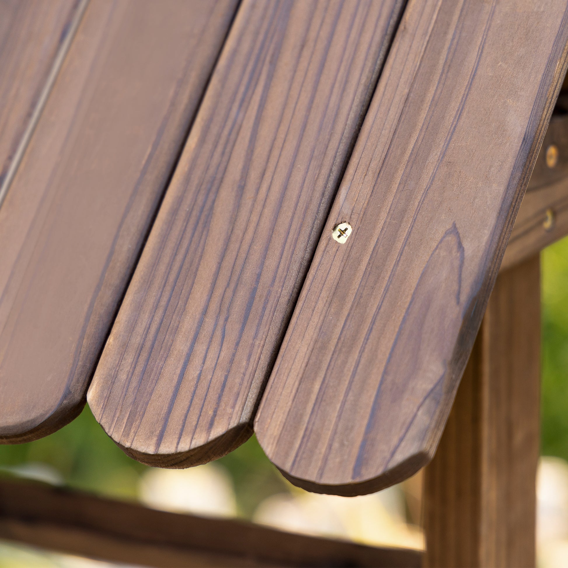Close-up of wooden slats with a screw on a blurred natural background