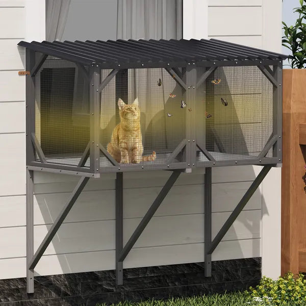 Cat sitting on a metal outdoor cat house with mesh sides.