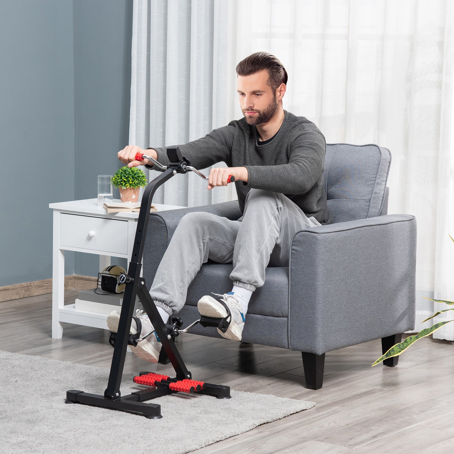 Man using a home exercise bike in a living room setting