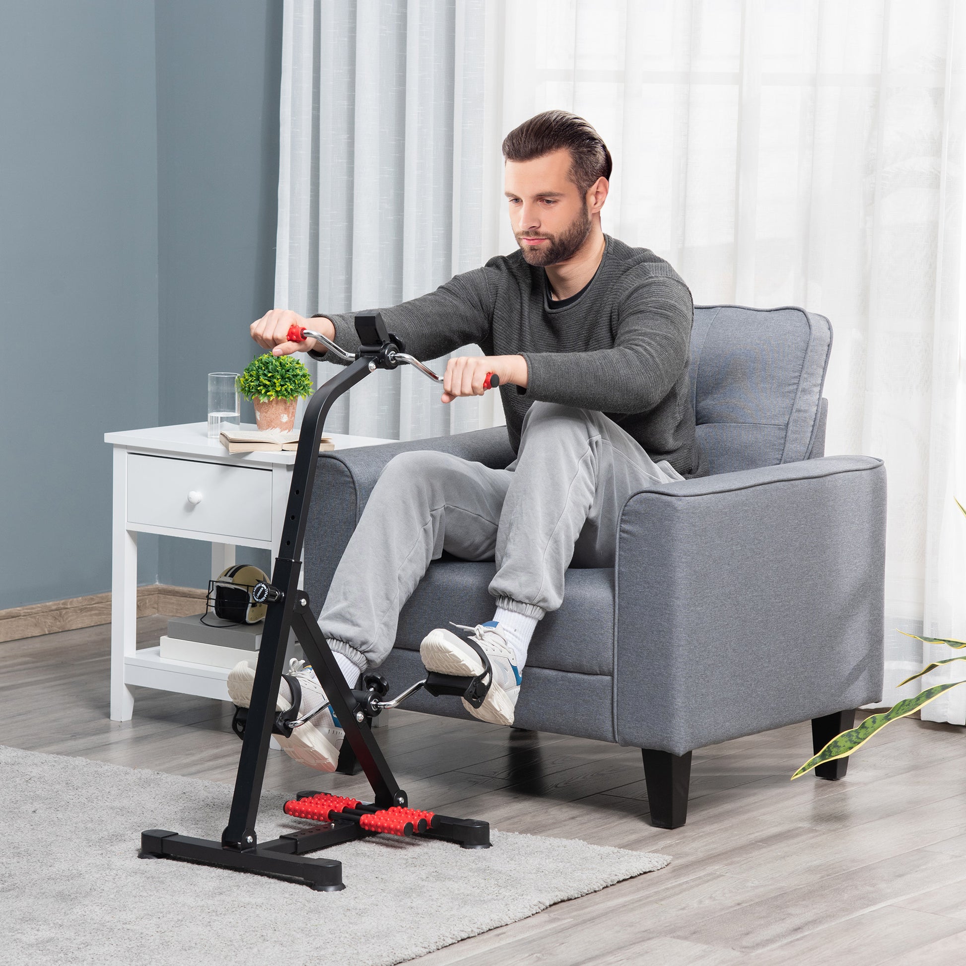 Man using a home exercise bike in a living room setting