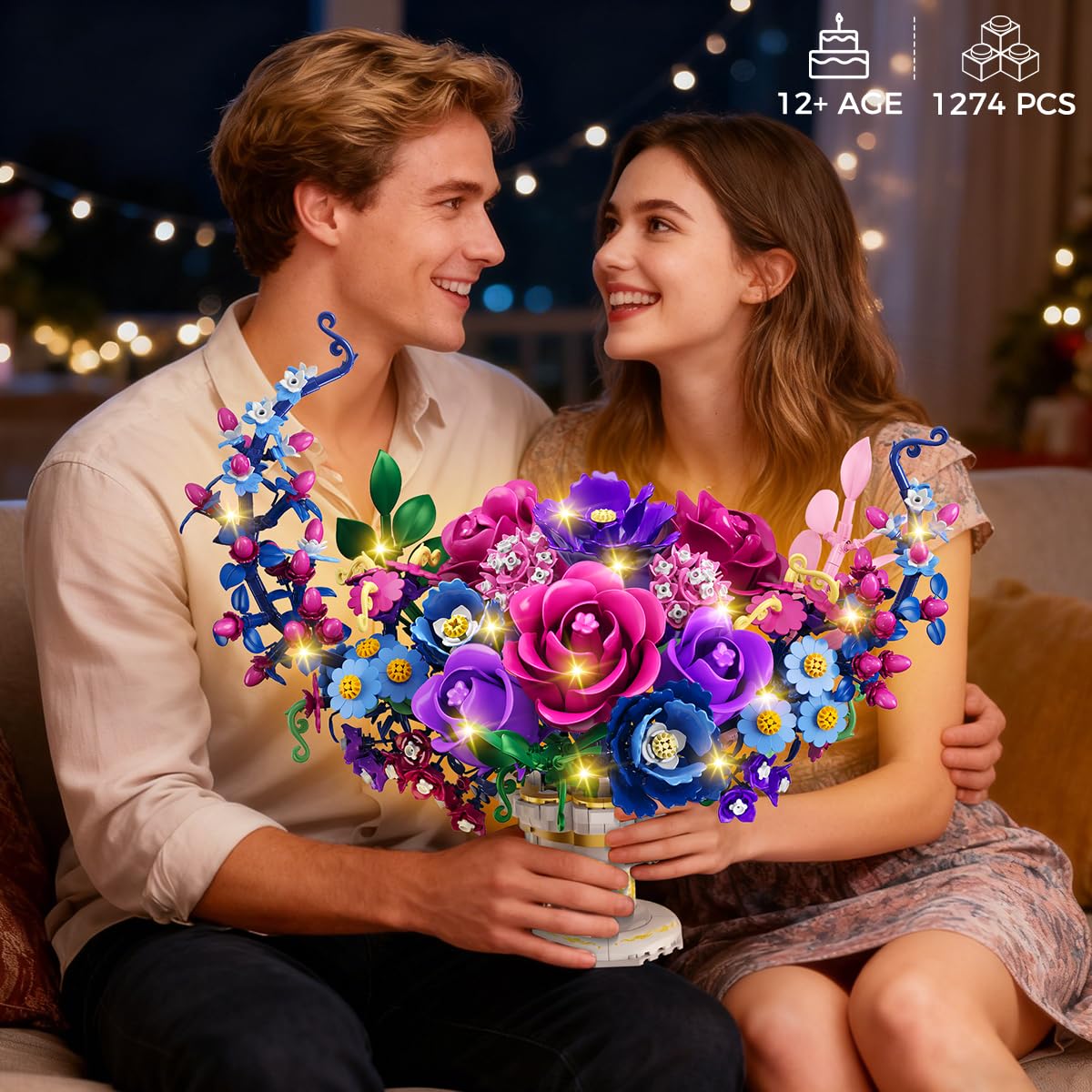 Couple holding a colorful flower-shaped LED light toy with a blurred festive background.
