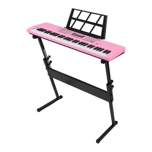 Pink electronic keyboard with stand on a white background