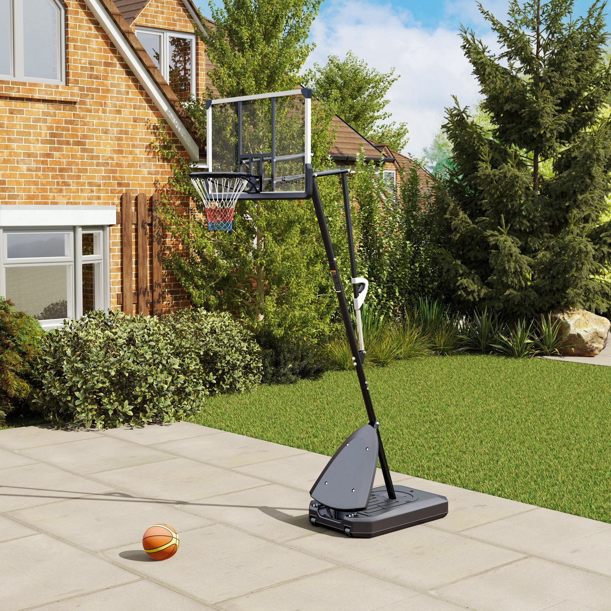 Basketball hoop with a ball on a patio in front of a house